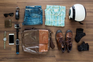 hipster clothes and accessories on a wooden background clipart