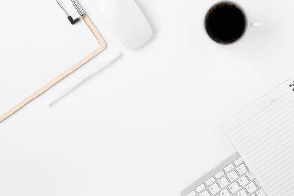 Minimal Office desk table top view with office supply and coffee cup on a white table with copy space, White color workplace composition, flat lay