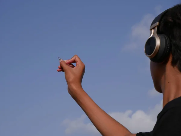 Boy Writing Pen Wearing Head Phone Sky Background Natural Education — Stock Photo, Image