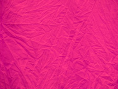 Pembe renkli tekstil kumaş dokusu ve arkaplanda sunulan ipek çizgi.