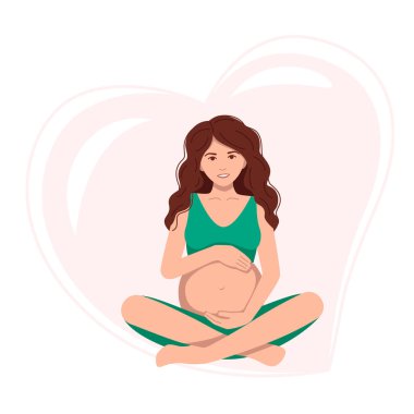 Hamile bir kadın oturmuş koca karnına sarılıyor ve meditasyon yapıyor. .