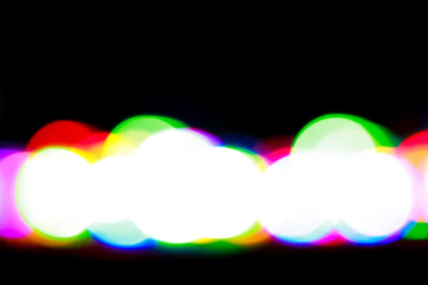 Colorful glowing circles on a black background. — Stock Photo, Image