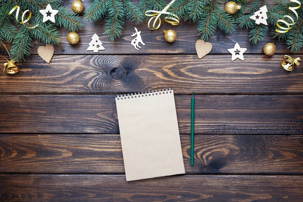 Wishlist, checklist, to do list activity for New Year on a wooden table. Xmas card. Christmas invitation. Top view.
