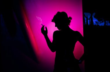 Smoking beautiful woman silhouette on pink background. Lifestyle, Fashion woman. clipart