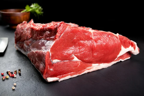 Fresh and raw meat. Ribeye. Uncooked steaks grilled BBQ on black background blackboard — Stock Photo, Image