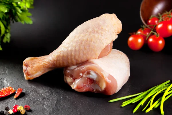 Fresh and raw meat. Raw chicken thighs white  ready to cook. Background black blackboard — Stock Photo, Image