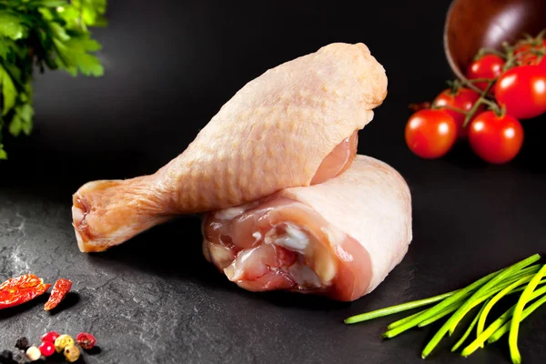 Fresh and raw meat. Raw chicken thighs white ready to cook. Background black blackboard — Stock Image Fresh and raw meat. Raw chicken thighs white ready to cook. Background black blackboard Stock Picture