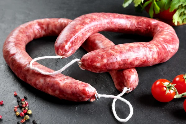 Raw and fresh meat. Fresh sausages and chicken meat ready to cook — Stock Photo, Image