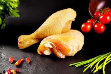 Fresh and raw meat. Raw chicken drumsticks ready for cooking. Still butchers. clipart