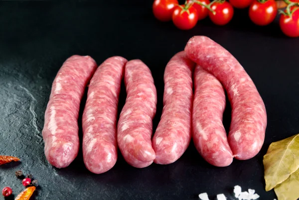 Raw and fresh meat. Fresh sausages and chicken meat ready to cook. — Stock Photo, Image