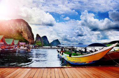 Adaman sea and wooden boat in Thailand. Beautiful tropical beach