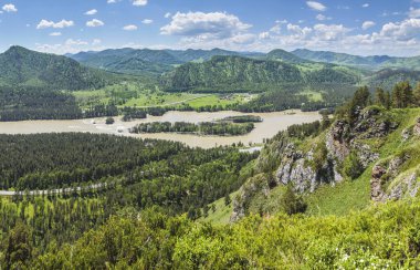View of the Katun river valley, Altai. Sunny day in early summer. Travel and vacation in the mountains.	