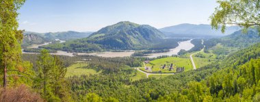 Panoramic view of the Katun river valley, Altai. Sunny day in early summer. Travel and vacation in the mountains.	