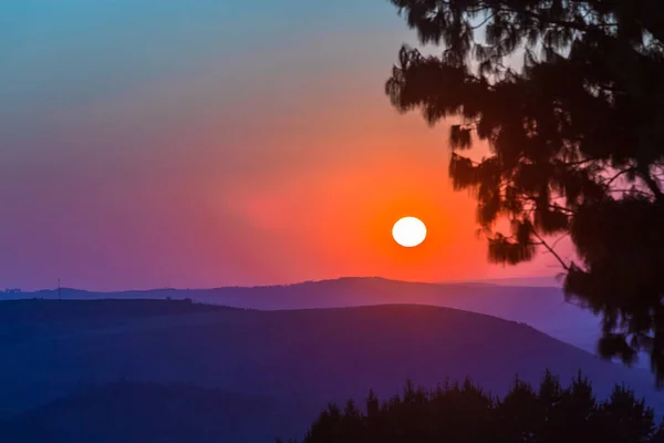Morning sun colors over mountains valleys silhouetted trees scenic outdoors travel explore hiking landscape