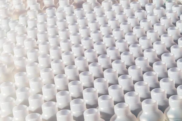 Plast flaskor dussintals — Stockfoto