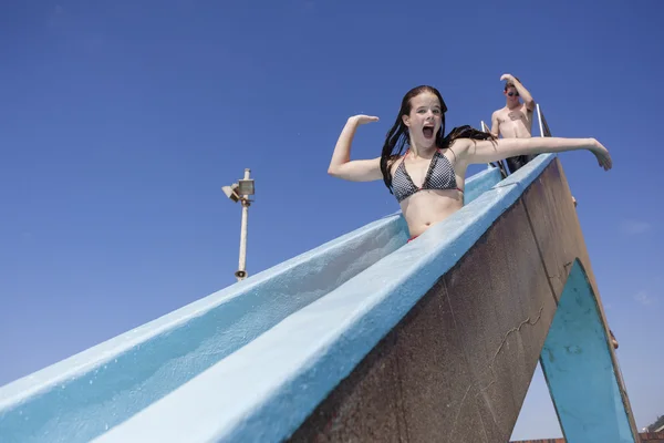 Teenagers Pool Slide Splash Holidays — Stock Photo, Image