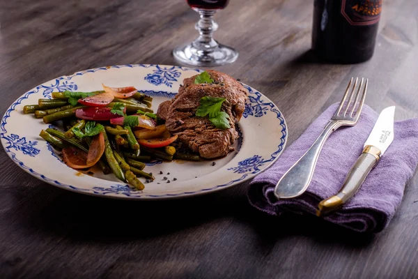 Beef Steak with some salad and a glass of wine — Stock Photo, Image