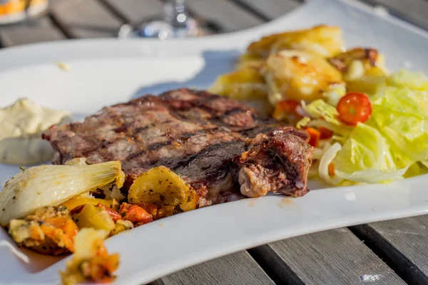 Grilled beef steak on white plate — Stock Photo, Image