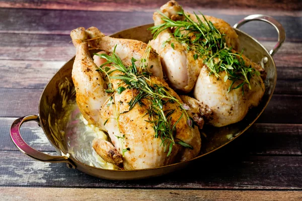 Grilled chickens on a owen plate — Stock Photo, Image