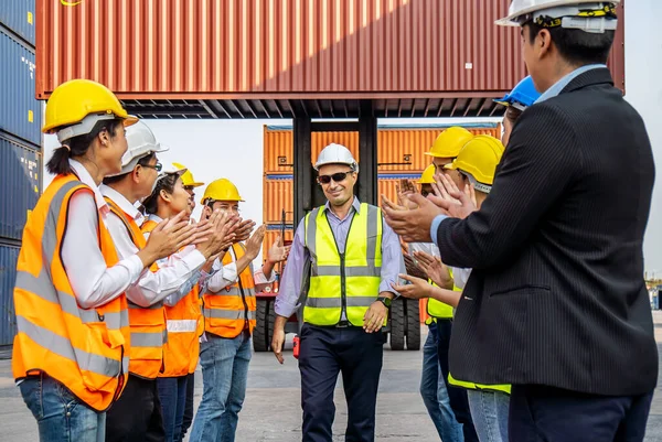 Professional Engineering and worker team congratulated success by applaud their jubilant leader after construction project complete with success. Engineering heavy industry concept