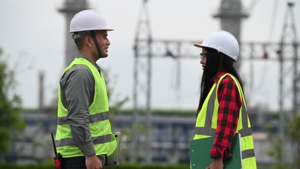 Two Engineers Working Power Plant Helping Each Other Analyze Problem — Stock Video