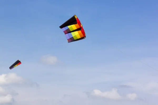 Colorful kite in the blue sky — Stock Photo, Image