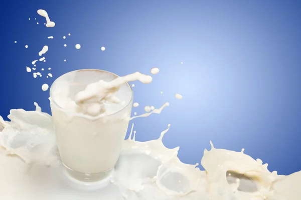 Glass of milk are splashing — Stock Photo, Image