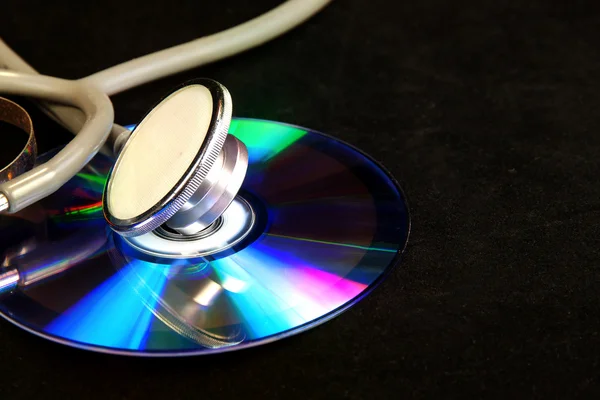 Disk CD ve stetoskop — Stok fotoğraf