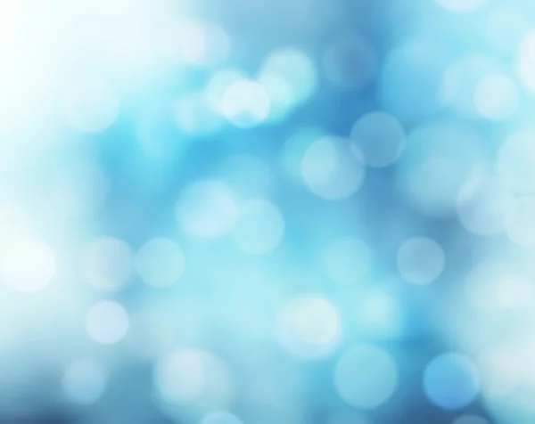 Blue defocused blur lights snowy winter background. — Stock Photo, Image