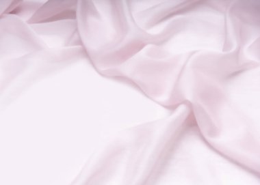 Yumuşak pembe tekstil katlanmış, kadınsı arkaplan, kaçınma alanı, ışık perdesi arkaplanı, güzel doku, kozmetik arka plan.