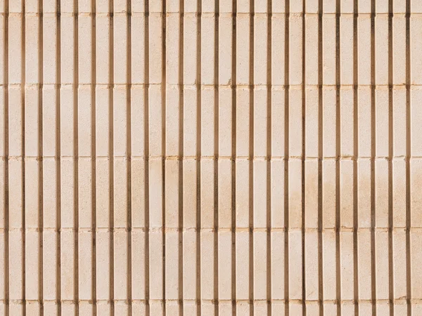 Alte beige Wand aus Betonklötzen — Stockfoto
