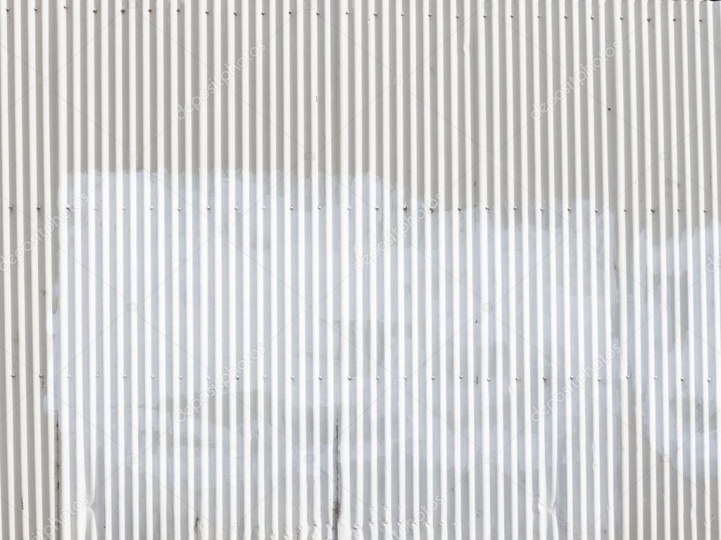 white wall of a metal gofrolist outdoors
