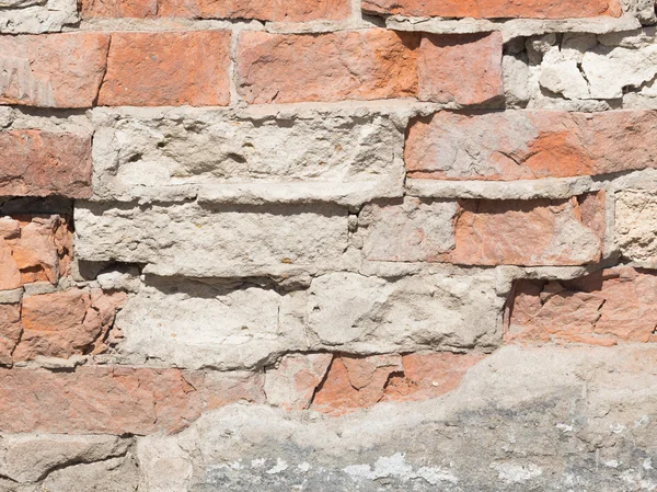 Rough wall with red bricks — Stock Photo, Image