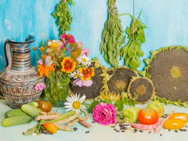 Still life with flowers and harvest — Stock Photo, Image