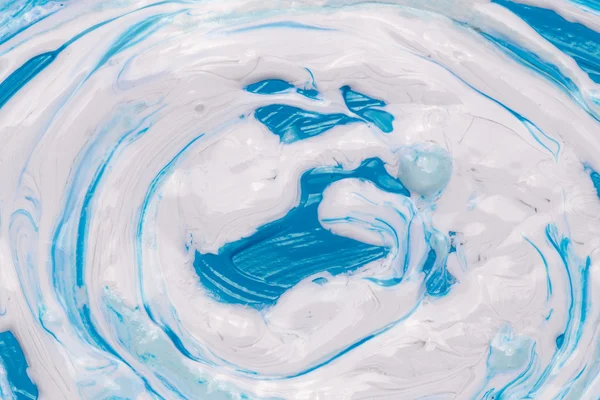 Blue and white acrylic paint mixed — Stock Photo, Image