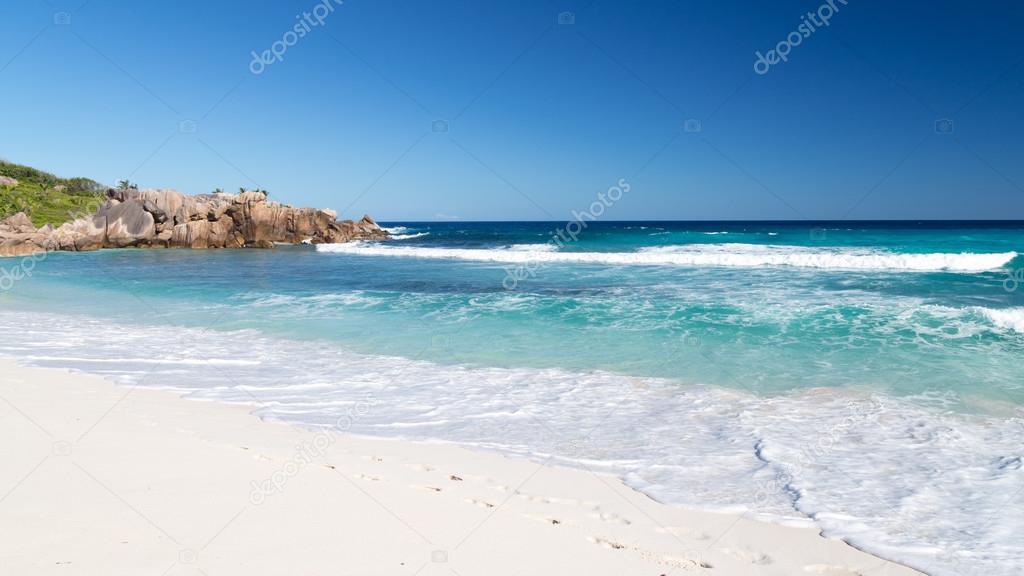 human footprints on the white sand