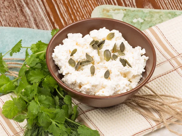 Cheese with pumpkin seeds — Stock Photo, Image