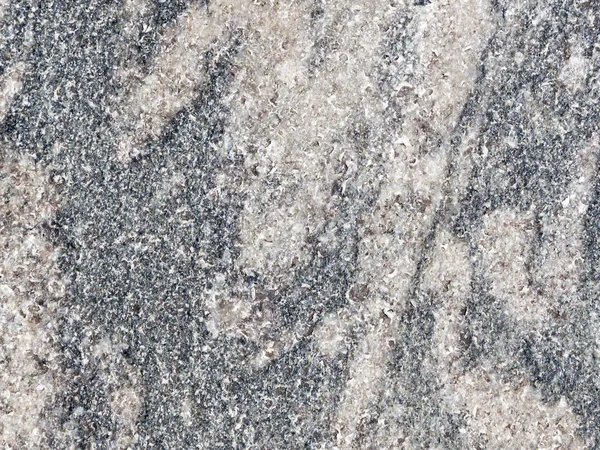 Natural gray granite interspersed with — Stock Photo, Image