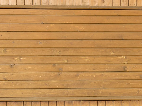 Houten grenen planken aan de muur — Stockfoto