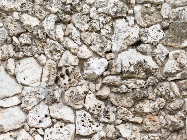 Wall of old natural tuff — Stock Photo, Image