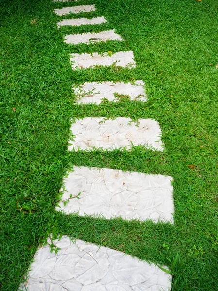 Stone walkway on grass Royalty Free Stock Images