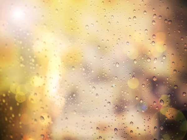 Abstract raindrop on glass window with warm filter and copyspace — Stock Photo, Image