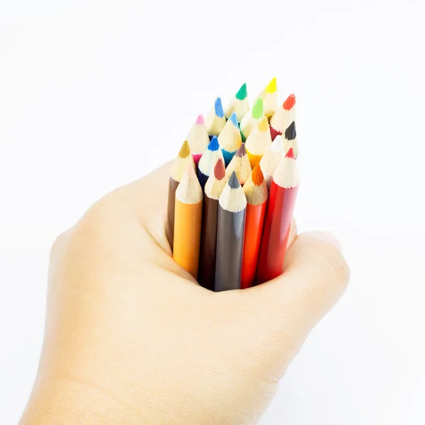 Lápis de cor na mão sobre fundo branco — Fotografia de Stock