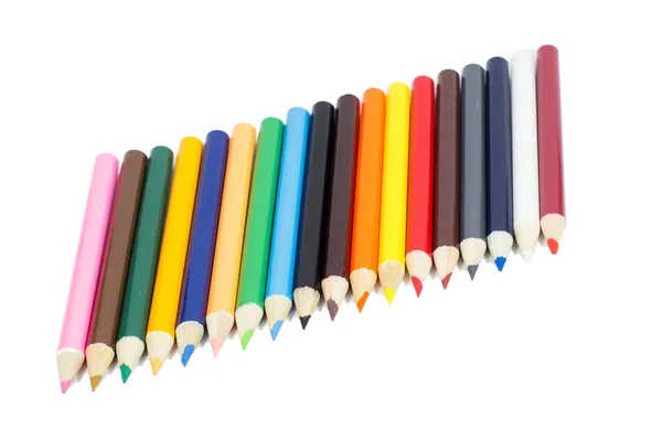 Lápis de cor que coloca no fundo branco — Fotografia de Stock