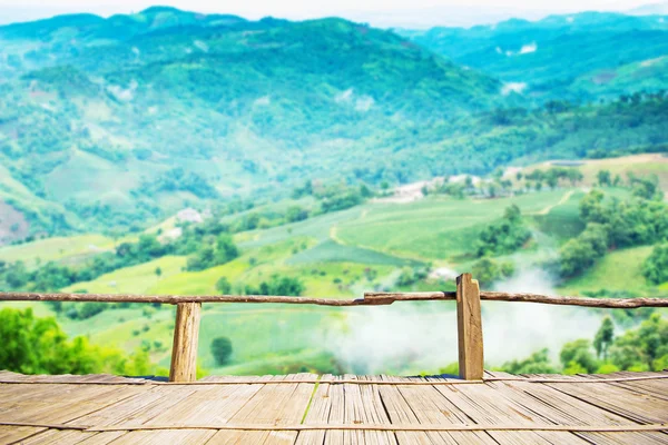 Bamboo terrace with view of blurry mountain view — Stock Photo, Image