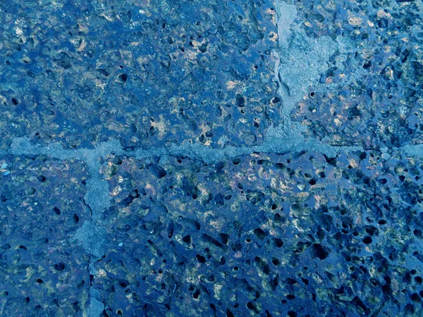 Pop art surreal style blue colored rough old stone floor surface