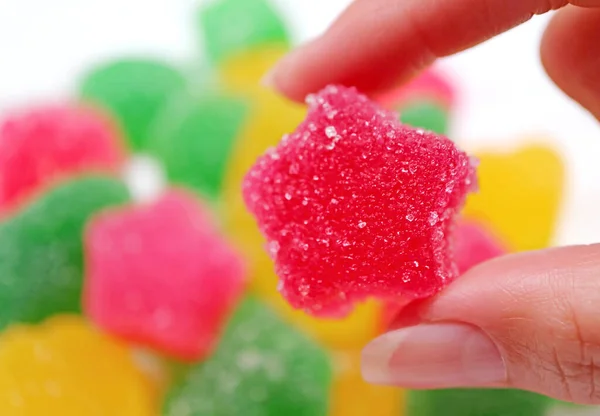 Woman Hand Picking Vibrant Hot Pink Sugar Coated Fruity Flavored — Stock Photo, Image