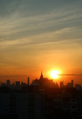 The Bright Sun Rising Over the Silhouette of Phu Khao Thong (Golden Mount) of Wat Saket Temple, One of Bangkok's Iconic Landmarks, Thailand