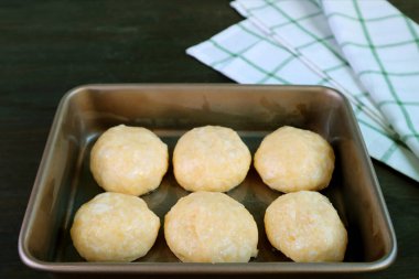 Dough in baking tray ready for baking Brazilian cheese bread or Pao de Queijo