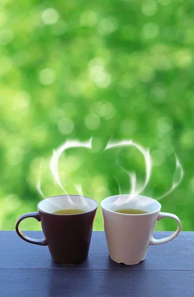 Two Cups Green Tea Heart Shaped Steam Wooden Table Green — Stock Photo, Image